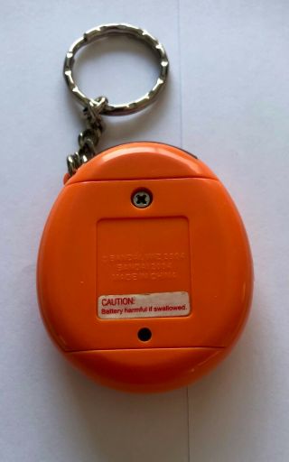 Tamagotchi Connection v1 2004 orange & purple,  great,  battery 2