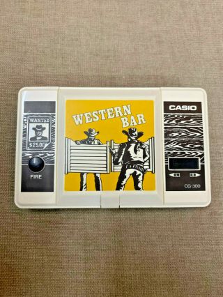 Casio Cg 300 Western Bar Lcd Hand Held Video Game