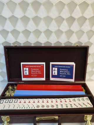 American Mahjong Set With Hard Brown Leather Case And Colorful Trays.