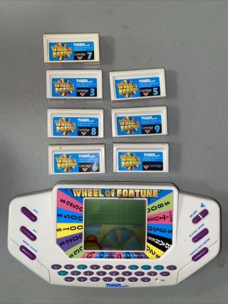 Vintage 1995 Wheel Of Fortune Tiger Electronics Handheld Game With 7 Cartridges