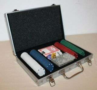 Poker Set.  200 Poker Chips,  2 Card Decks And Metal Storage/carrying Case.