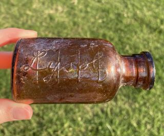 Vintage Amber/ Brown Embossed Glass Lysol Bottle
