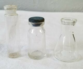 10 Ml Clear Glass Erlenmeye And Two Other Very Small Clear Glass Bottles