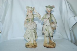 Copyright L & M Inc.  Man & Woman Figurines Ceramic Bisque Colonial Statues 8 "