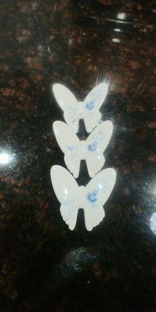 A vintage set of 3 matching porcelain butterfly wall hangings by Homco 3