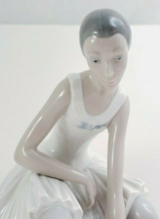 Nao By Lladro Ballerina Girl Sitting On A Stool Taking Off Shoes
