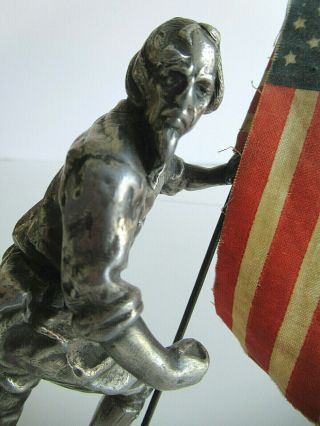 Antique heavy metal casting of Uncle Sam with flag 2