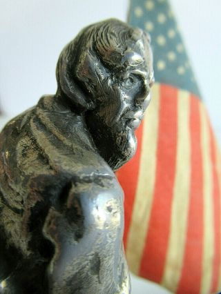Antique heavy metal casting of Uncle Sam with flag 3