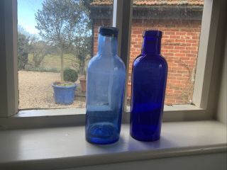 Two Large Cobalt Blue Pharmacy Bottles