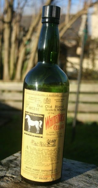 1958 White Horse Cellar whisky bottle.  White Horse whisky bottle.  UGB dark green 2