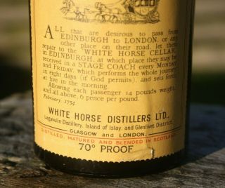 1958 White Horse Cellar whisky bottle.  White Horse whisky bottle.  UGB dark green 3
