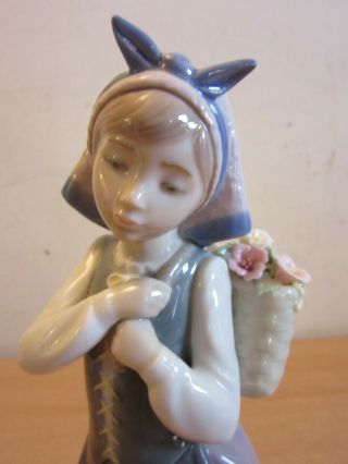 Lladro: Dutch Girl with flower basket on back porcelain figure 10.  5 