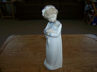 Nao By Lladro Figurine Girl In Nightgown & Cap Holding Doll