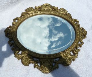 Antique Ornate Burnished Gold Cast Iron Oval Bevel Glass Wall Mirror,