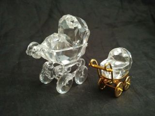 Two Swarovski Crystal Baby Carriage Stroller Figurines