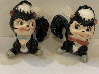 Vintage Japan Boy And Girl Skunk Salt & Pepper Shakers With Blue And Pink Bow