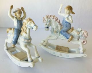 2 Paul Sebastian Porcelain Figurines Boy & Girl On Rocking Horses Meico 1991