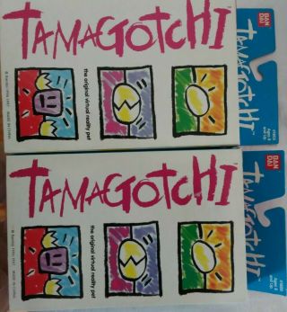 Two 1996/1997 Bandai Tamagotchi Virtual Pets Red And Gold Rare
