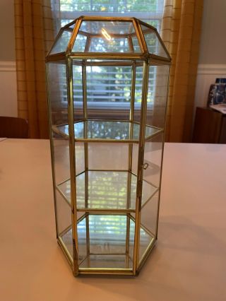 Small glass display case with glass shelves and mirror on bottom shelf. 2