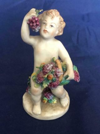 Fine Vintage Potruguese Porcelain Hand Painted Cherub Figure.
