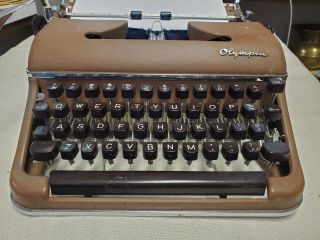 Vintage Olympia Deluxe Portable Brown Typewriter With Case