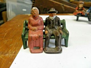 Vintage Antique Solid Cast Iron Painted Figures Sitting On A Park Bench