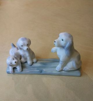 Vintage Blue,  White Porcelain Mamma Dog/w 2 Puppies 3 " Tall