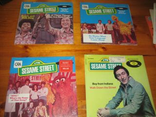 4 vintage Sesame Street 45 Records, .  Snuffalufagus sings 2