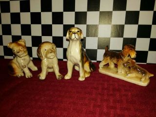 Vintage Japan 4 Piece Ceramic Dog Figurines