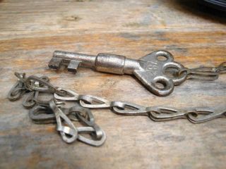 UNUSUAL ANTIQUE KEY AND CHAIN NUMBER ON LUG LOCK END AS WELL AS FINGER PLATE 2