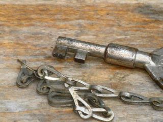 UNUSUAL ANTIQUE KEY AND CHAIN NUMBER ON LUG LOCK END AS WELL AS FINGER PLATE 3