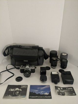Vtg Canon At - 1 Slr 35 Mm Camera And Several Lenses,  Flash,  Manuals,