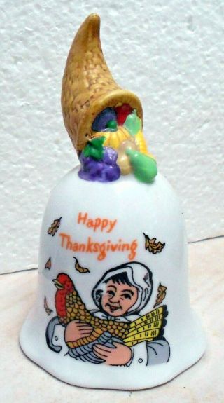 Vintage Porcelain Bell With Happy Thanksgiving On It.  And Has A Pumpkin Ringer.