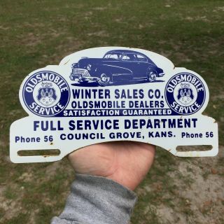 Winter Sales Co.  Oldsmobile Metal License Plate Topper Sign