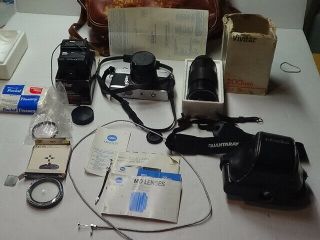 Minolta SRT 101 Camera with lenses,  accessories,  leather case,  and vintage tote 3