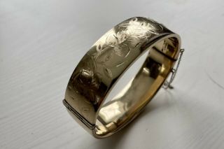 A Vintage 1950s 9ct Rolled Gold Metal Cored Opening Bangle With A Scroll Design