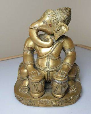 A Late 19th Century Bronze Statue Of A Seated Ganesha Playing The Drums.