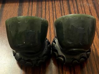 A Small Chinese Green Jade Cups With Wooden Stands.