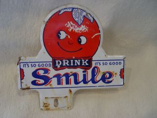 Vintage Smile Orange Soda Drink Stamped Metal Advertising License Plate Topper