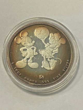 1988.  999 Fine Silver 1oz Mickey & Minnie Disney Around The World Coin