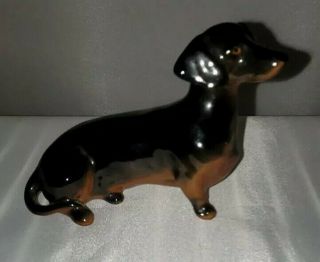 Beswick England Retired Figurine Of A Seated Dachshund Dog,  Black/tan