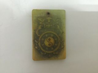 A White Jade Pendant Carved Of Inscriptions
