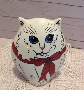 Nina Lyman White Persian Cat With Red Bow Vase Retried