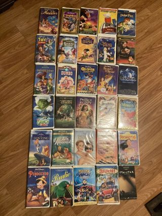 Vintage Disney Vhs Tapes With Emerson Dvd/vhs Combo Player.