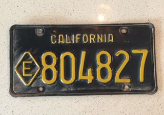 California (black Base) State Exempt " Diamond E " License Plate,  Expired