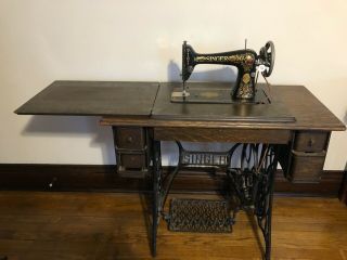 1910 Vintage Singer Red Eye Sewing Machine With Oak Cabinet.  Has Belt And.