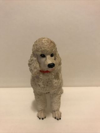 White Poodle Resin Figurine With Red Bow.