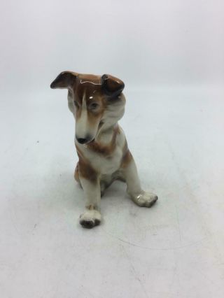 Sitting Collie Puppy Porcelain Figurine.