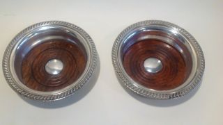 A Matching Antique Silver Plated Wine Bottle Coasters By Barker Ellis.