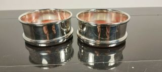 A Matching Antique Silver Plated Wine Bottle Coasters.  1920.  S.  Ornate.